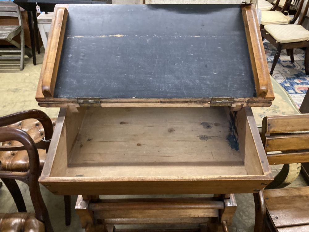 A 19th century Continental oak metamorphic rise and fall students desk together with a matching chair, desk width 66cm